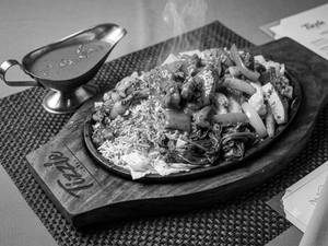 Grilled chicken orange sauce sizzlers