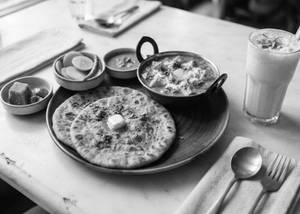 Stuffed Paratha With Paneer Butter Masala