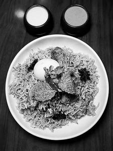 Muradabadi Mini Chicken Biryani Served With Raita