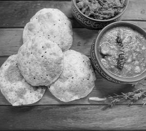 Dal with 5 poori and salad