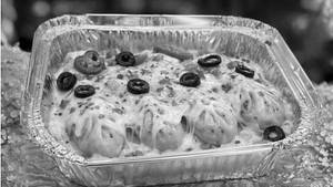 Chicken Cheesy Baked Momos