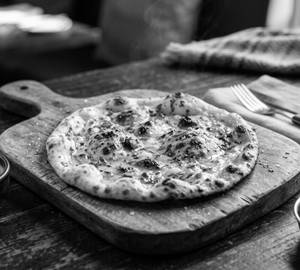 Butter Tandoori Roti (1 Pc).