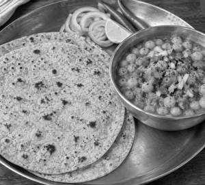 3 roti with ghugni ( 250 ml) and salad.