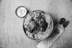 Mutton Dum Biryani Served With Raita