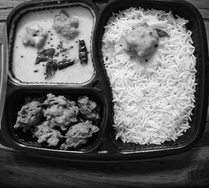 Kadhi Pakora And Rice in tray 