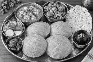 North Indian Thali(4 puri ..paneer..sabji..sukhi sabji..pulav..rice..1 sweet ...salad..achar..papad.