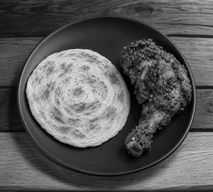 Parotta With Vizhinjiyam Chicken Fry