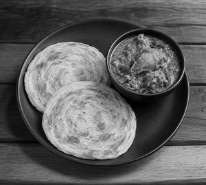 Parotta With Nadan Kozhi Curry
