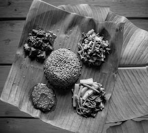 Smoked pork with anishi thali