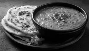 Dal tadka + Tandoori Butter Paratha (1 piece)