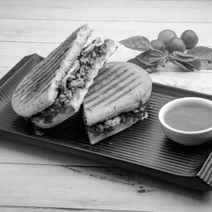 Sundried Tomato Basil Tapenade Sandwich In Panini Bread (veg)