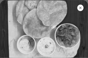 Aloo Pyaaj Zeera Ki Sabzi With 4 Nos. Poori & Raita.