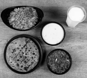 Ringan Bharthu [250 ml] + Bajri Rotlo [1 Pc] + Masala Khichdi [1 Plate] + Buttermilk