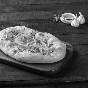 Freshly baked garlic flatbread with cheese