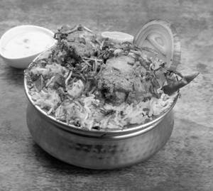 Chicken Lazeez Dum Biryani.          