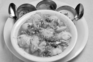 12 Mini Idlis Dipped In Sambar Bowl