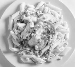 Chicken and corn pasta in red saurce