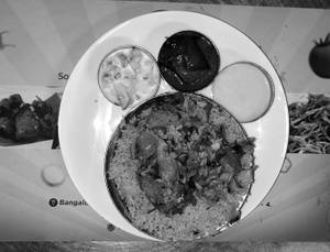 Mutton Biryani (Nawabi Style)(served with sweet,raitha & oil brinjal)