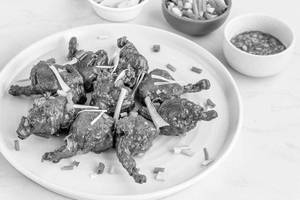 Chicken Lollipop saucy