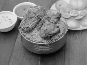 Chicken Dum Biryani(serves with Raita and Gravy)