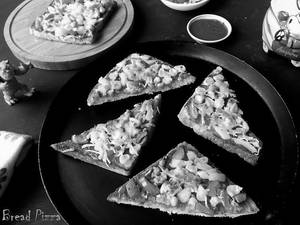 Schezwan Bread Pizza(veg)
