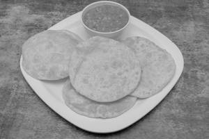 4 Luchi With Cholar Dal