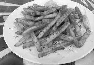 Peri Peri French fries. (Served with tomato sauce)