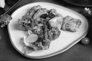 PAN ROASTED KASUNDI CHICKEN SERVED WITH GRILLED TOMATO