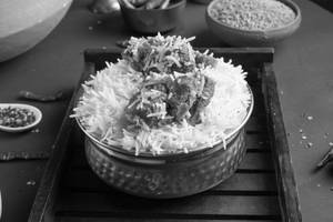 Lucknowi Gosht Biryani (2 Pcs)