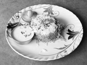 Veg. Dum Briyani & Raita