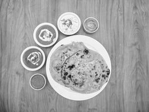 Butter Tandoori  Roti (4 Pcs)Thali(Dal Makhani + Shahi Paneer + Raita + Salad)