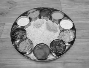 Meal Parcel (Rice + Dal + Curry + Sambar + Rasam + Roti Chutney + Curd + Fry and Friona or Papad)