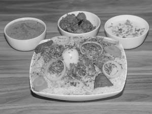 Mutton Special Biryani(served with 1 Boiled egg, Chicken 65 (half), Mirchi-ka-salan, Raita, Salad)