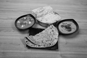 Aloo Paratha + 10 Phulka + Tadka Dhal + Mix Veg Curry