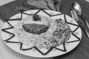 Three Cheese Cake Steak On Creamed Spinach With Spaghetti