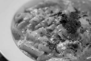 Veg Penne Pasta In Tomato And Cheese Sauce