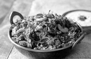Hyderabadi Dum Biryani With Raita, Pickle & Papad