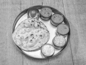 North Indian Meals (sabji + Gravy + Papad + 2 Roti + Sweet + Rice)