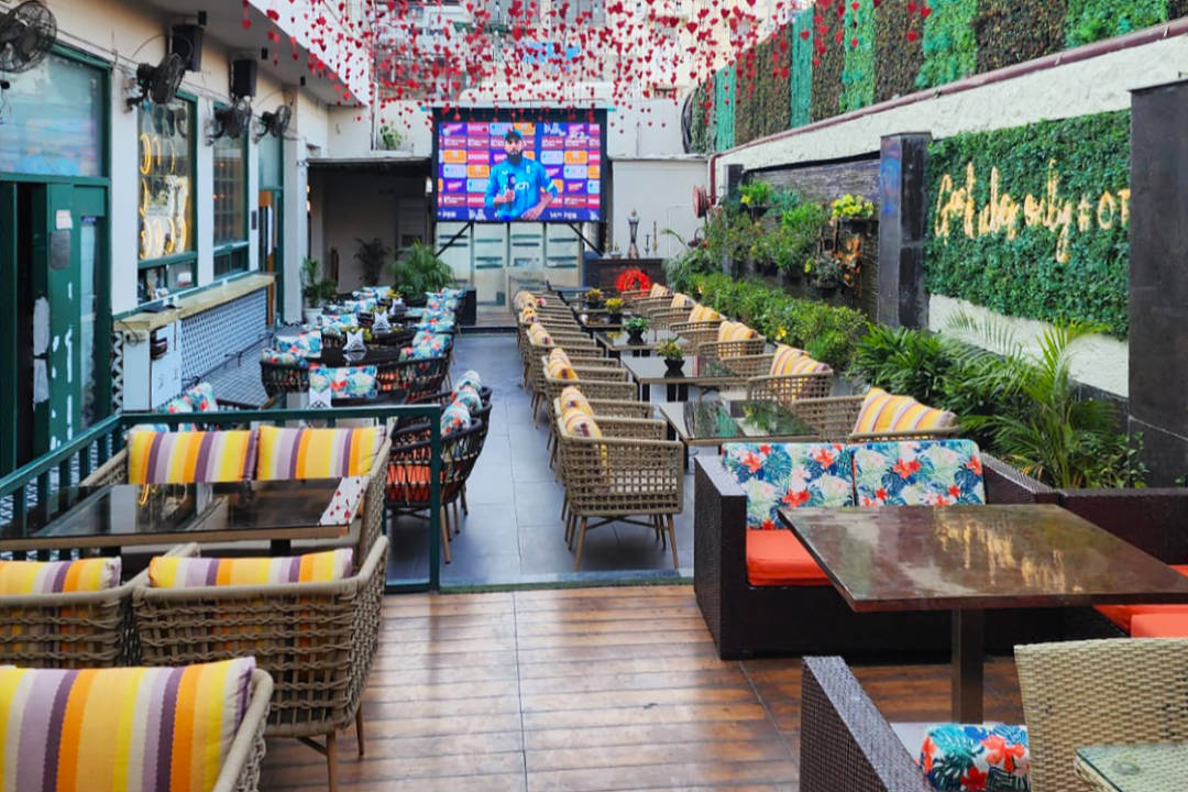 Luxury couple dining at The Junkyard Cafe Connaught Place under 2000 budget 2026